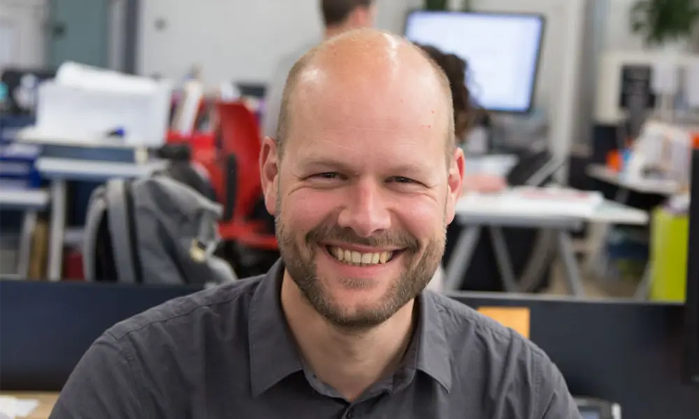 man smiling in office