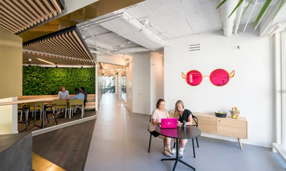 ide netherlands office with two people sat at a table